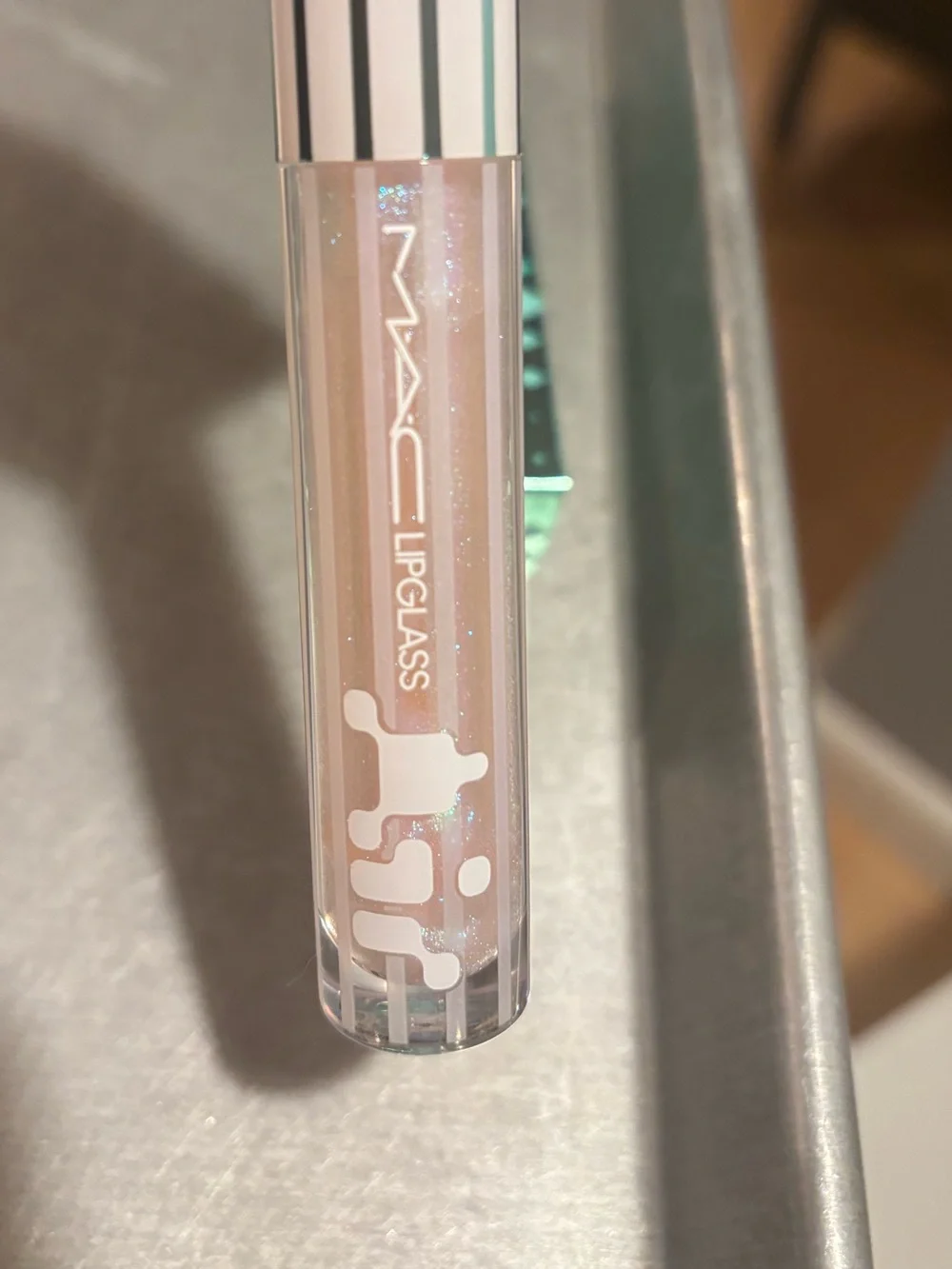 MAC Cosmetics Lipglass Gloss in shade Frozen a shimmery pink w blue reflect